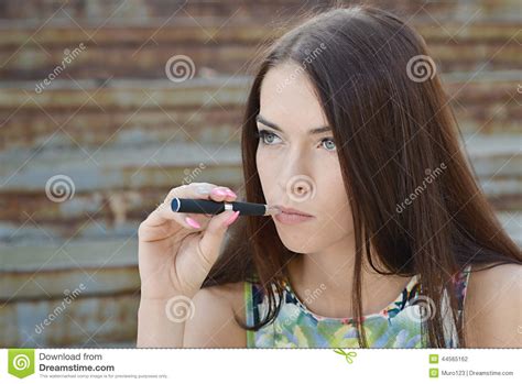 Young Woman Smoking Electronic Cigarette E Cigarette