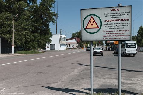 Yellow radioactive sign in the chernobyl exclusion zone near the ghost town of pripyat and the chernobyl nuclear reactor (kiew, ukraine, europe). 1986 - The nuclear Hell of Chernobyl and the Fox of Pripyat Ghost Town