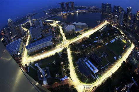 An Aerial View At Dusk Shows The Illuminated Marina Bay Street Circuit