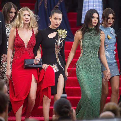The models and their mom, 54, recreated the iconic dinner party scene in which the possessed guests sing harry belafonte's banana boat song — and the resulting. Bella Hadid helped sister Gigi Hadid hold the train of her ...
