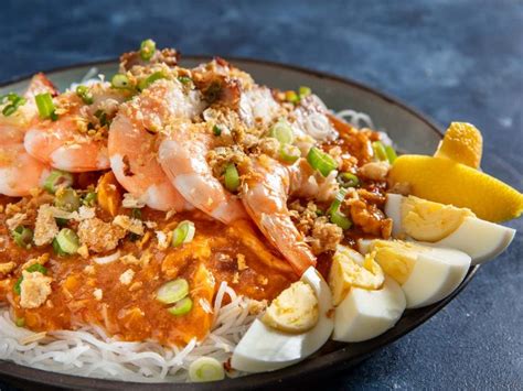 Pancit Palabok Filipino Noodles With Smoky Pork And Seafood Sauce