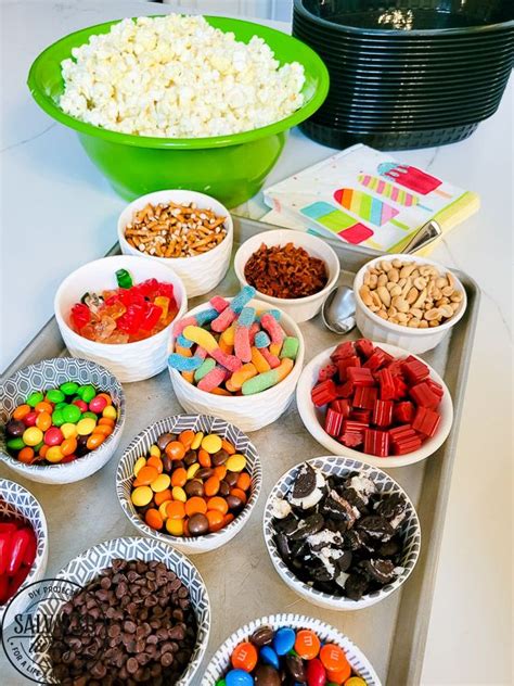 A Table Topped With Bowls Filled With Different Types Of Candy And