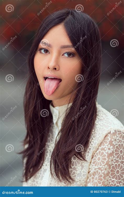 Beautiful Asian Woman Showing Tongue Stock Image Image Of Female Black 80270763