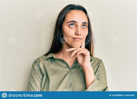 Young Hispanic Woman Wearing Casual Clothes Serious Face Thinking About