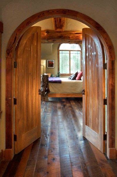 Installing a barn door on a master bathroom. arched double doors and reclaimed floors - beautiful ...