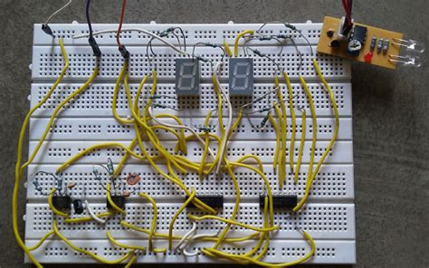 Seven segment up counter and timer circuit. People or Object counter Circuit diagram using IC 555 and IC 4026 - Gadgetronicx