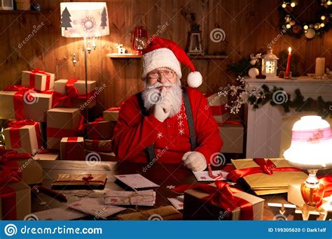 Santa Claus Showing Shh Secret Gesture On Christmas Eve Sitting At Home