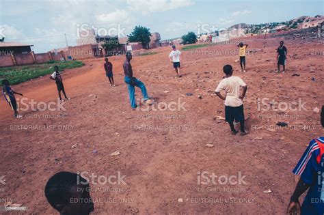 Black African Children Playing Soccer In A Rural Area Stock Photo