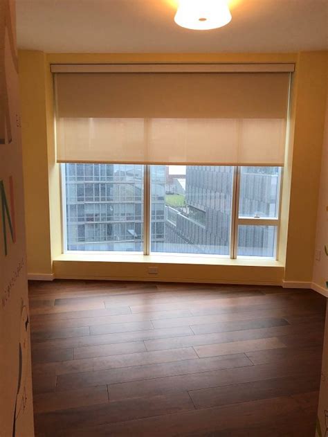 Bali dual shades give you full control over light and privacy by combining roller and solar shades into one versatile window treatment. Dual Shades in Luxury High-Rise - Motorized Solar Shades NYC