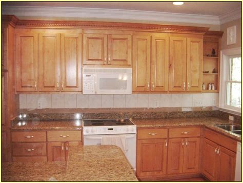 Stained wood cabinets compliment venetian gold's light earthy tones, creating a naturally inviting kitchen that is seamless from cabinets to countertop. Venetian Gold Granite Countertops With White Cabinets ...