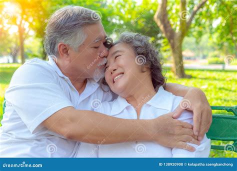 Portrait Romantic Older Couple Attractive Handsome Older Husband Embracing And Kissing His