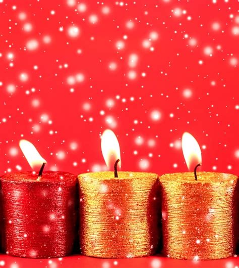 Premium Photo Christmas Candles And Shiny Snow On Red Background