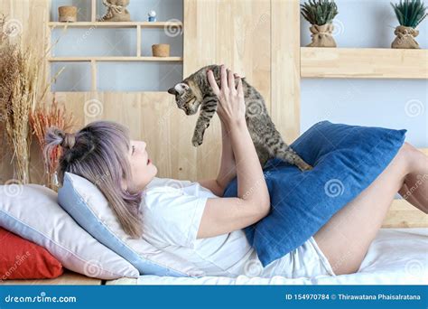 Women And Cats In A Beautiful Living Room Stock Photo Image Of Hair