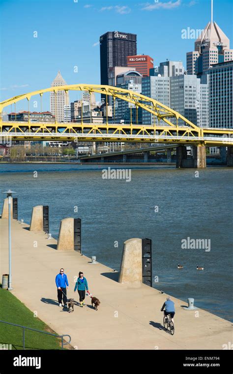 People Walk And Bike Along The Three Rivers Heritage Trail On The North
