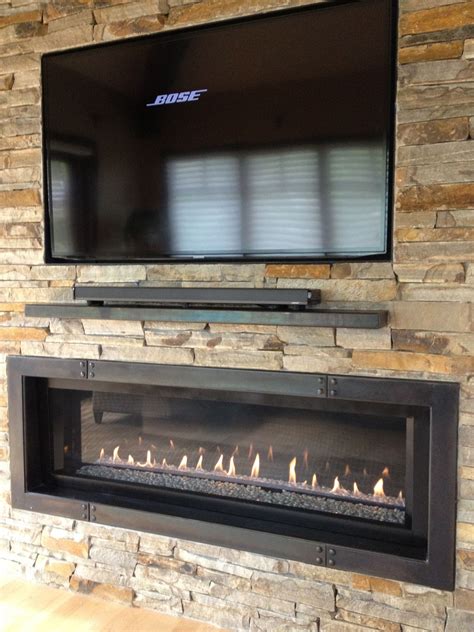 Faux stone fireplace ideas kvriver. 60" TV with 5' ribbon fireplace plus custom iron surround ...