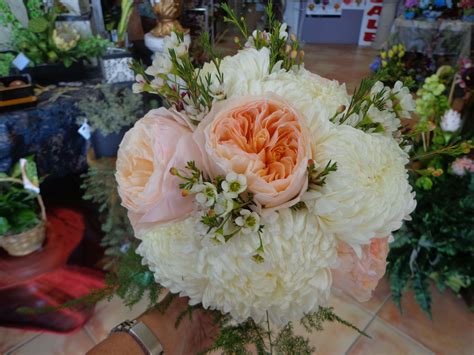 Wholesale flowers, shipped fresh from the farm straight to your door! White Football Mums and peach Garden Roses accented with ...