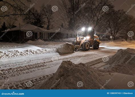 Service Snow Plowing Truck Cleaning Residential Street During Heavy