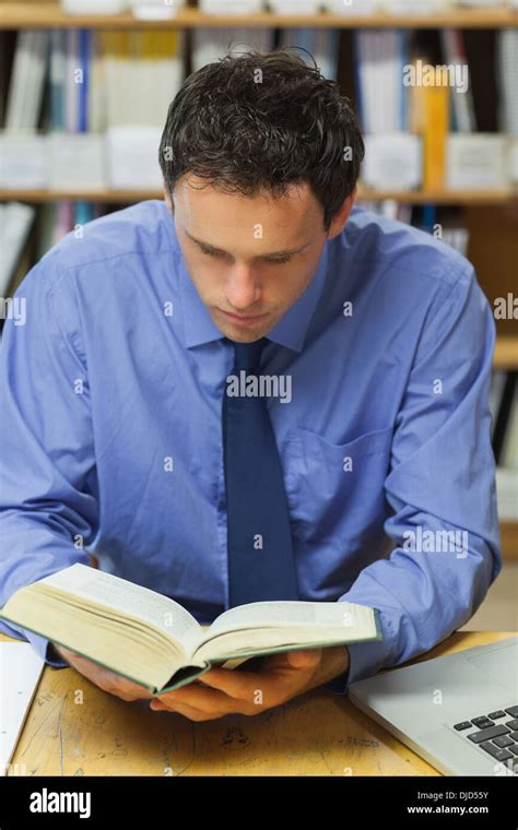 Calm Librarian Reading A Book Stock Photo Alamy