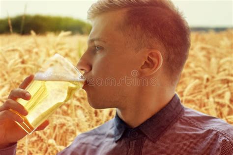 Close Up Of Young Man Drinking Beer From Glass Stock Photo Image Of
