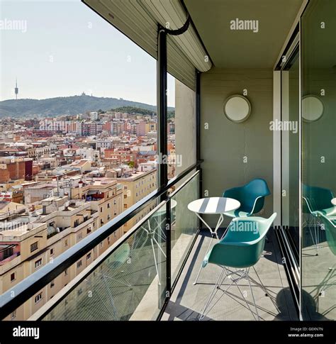 Escorial Apartment Barcelona Spain Two Modern Chairs And Small Table