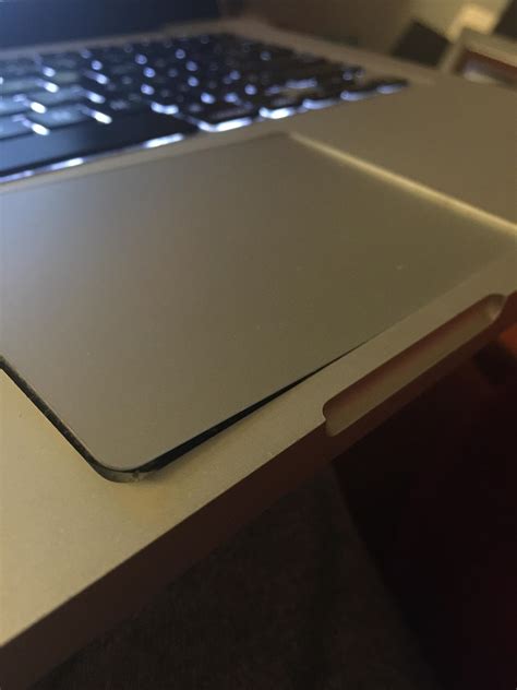 How Can I Fix My Brokenbentstuck Trackpad On My Macbook Pro Trying