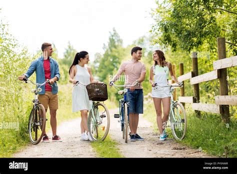 Happy Friends With Fixed Gear Bicycles In Summer Stock Photo Alamy