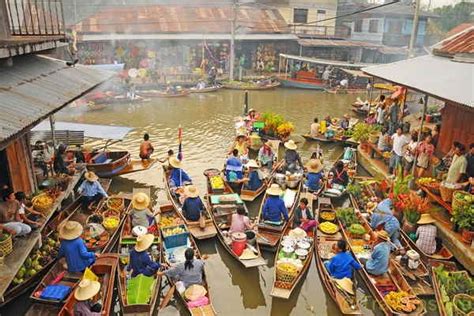 Both during the day and after dark the atmosphere is lively. Amphawa Floating Market - Travoinspire