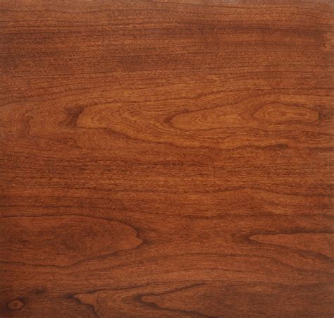 Cherry wood in it's natural unfinished state has a light color with pink tones and over time changes to a warm brown that looks orangey to me. Upholstered Chair Pads - Ohio Hardwood Furniture