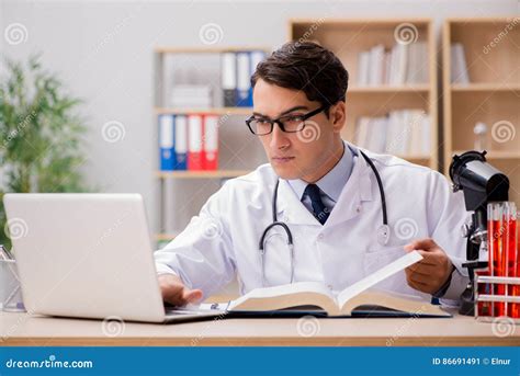 Doctor Is Studying Decoding Of Cardiogram Of Patient Heart Stock Photo