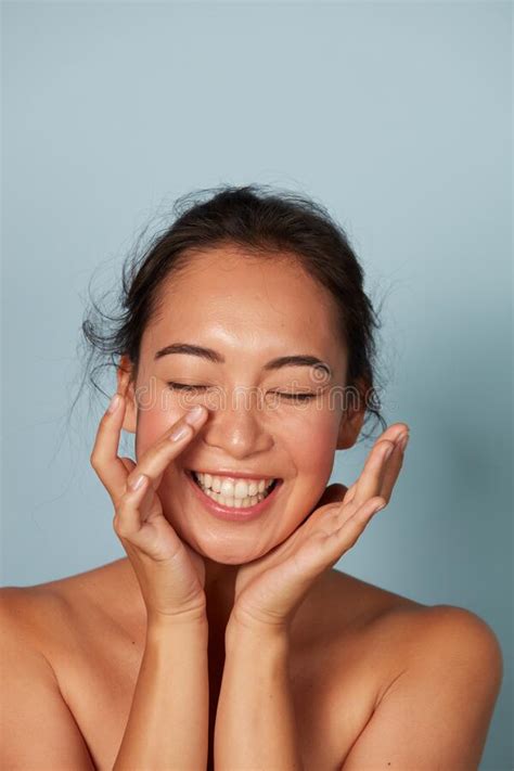 Beauty Face Smiling Asian Woman Touching Healthy Skin Portrait Stock