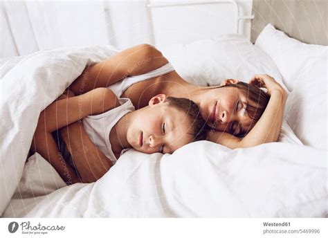 Mother And Son Cuddling In Bed A Royalty Free Stock Photo From Photocase