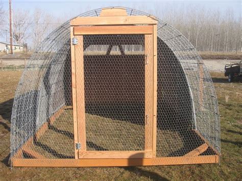 A Chicken Coop In The Middle Of A Field