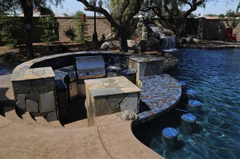 This island bed of plants breaks up the patio and makes it more interesting. Patios, BBQ Island, Firepit Backyard Options Backyard ...