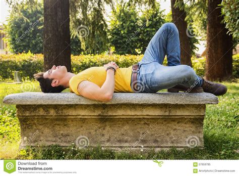 Attractive Young Man Sleeping On Stone Bench Stock Photo Image 57659785
