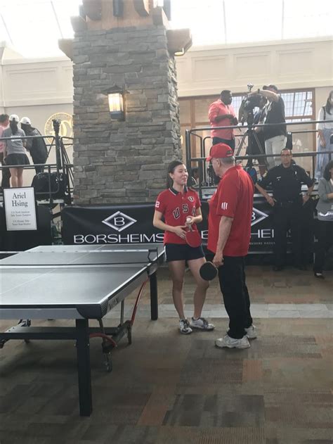 bill with u s olympic team member ariel hsing at ping pong match at berkshire hathaway event