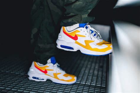 This limited version is a collaboration with japanese brand atmos and have a patchwork textile upper inspired by vintage nike clothing. Nike's Air Max 2 Light Brightens Up in "University Gold ...