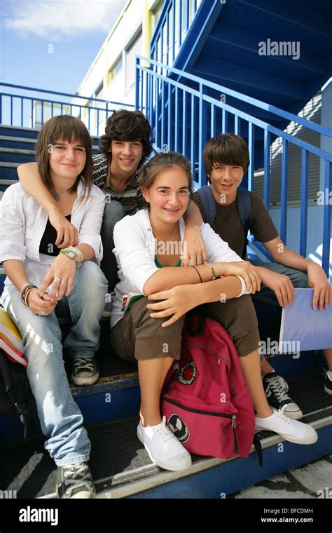 Group Of Teenagers Sitting On Stairs Stock Photo Alamy