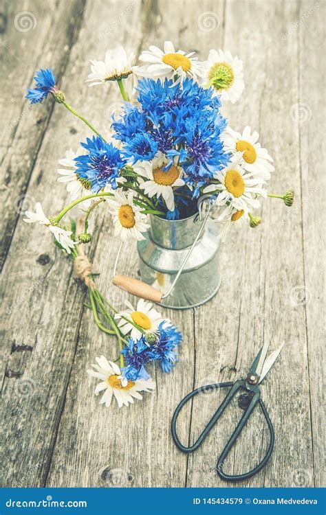 Bouquets Of Beautiful Wild Flowers Of Daisies And Cornflowers On A