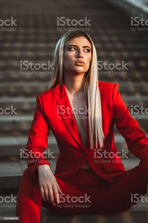 Female Beauty In Red Suit Relaxing On Staircase Stock Photo Download