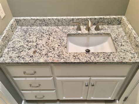Ashen White Granite Countertops Moen 8 Widespread Faucet Proflo