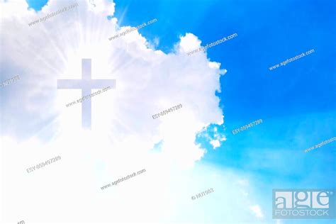 Christian Cross Appears Bright In The Sky Background Stock Photo