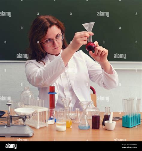 A School Teacher Sits In A Chemistry Class And Conducts Experiments
