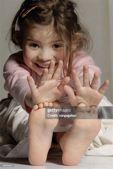 Little Girl Showing Her Hands And Feet High Res Stock Photo Getty Images
