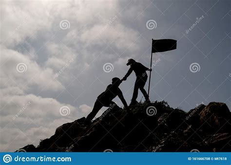 Friends Help Each Other To Mountain Top Stock Photos Free And Royalty
