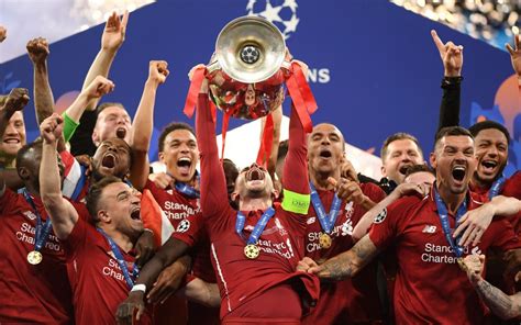 Jordan henderson raises the european cup high above his head. Liverpool kings of Europe for sixth time as Mohamed Salah ...