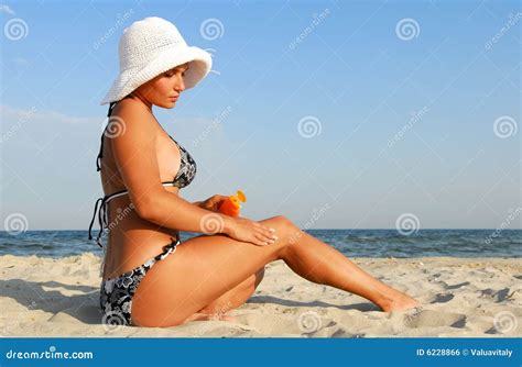 Woman Applying Suntan Lotion Stock Photo Image Of Serene Sensuality
