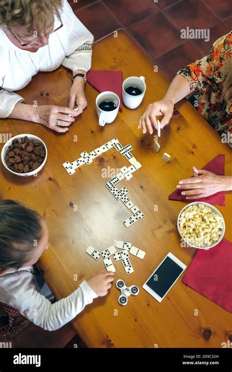 Top View Of Three Female Generations Playing Domino Stock Photo Alamy