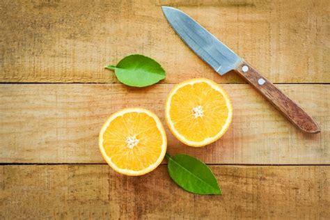 Premium Photo Orange Fruits With Leaf On Wooden Background Fresh