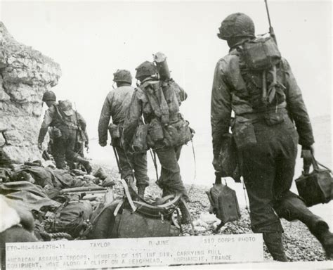 1st Infantry Division Soldiers On Normandy Cliffs In June 1944 The