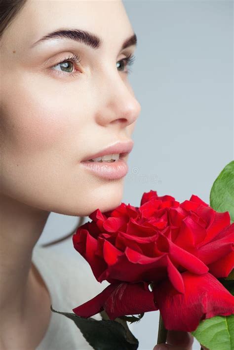 Beauty Fashion Model Woman Face Portrait With Red Rose Flowers